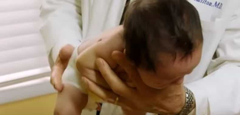 Paediatrician shows how to calm a crying baby
