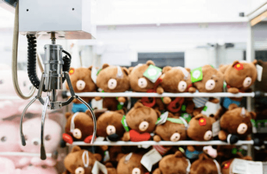 Little boy rescued after climbing INSIDE claw machine to get a toy