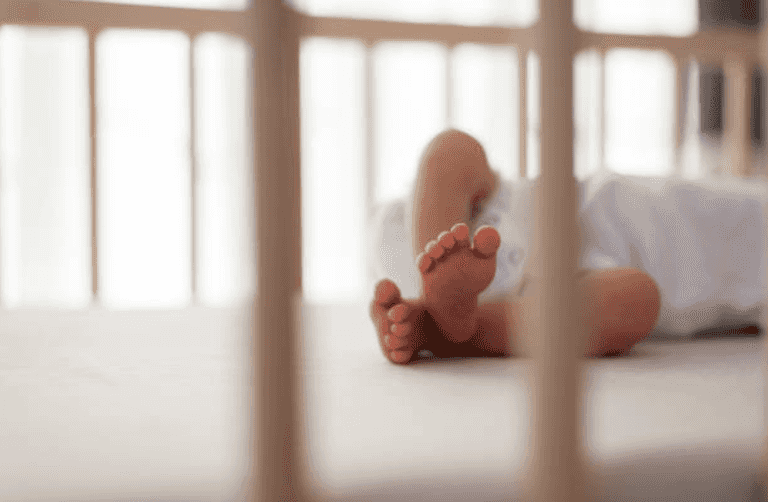 Coroner issues warning on co-sleeping after cot death incident