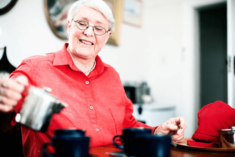Mother-in-law insists on drinking tea while holding her 5-month-old grandchild