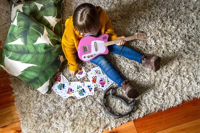 These guitars help to teach children to play music through augmented reality