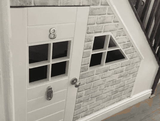 Creative grandad DIYs amazing under-the-stairs playhouse for his grandsons for less than €60