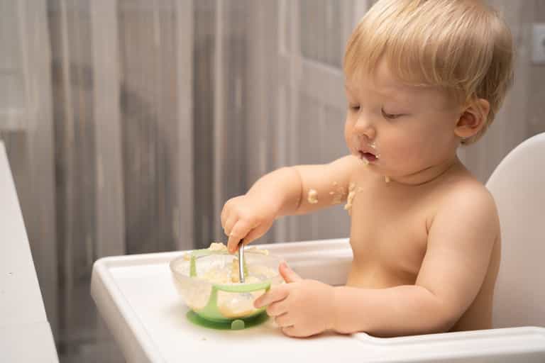 Professor of paediatrics advises parents to introduce food sooner to avoid allergies