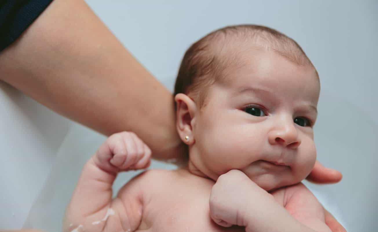 Mum slated for getting daughter’s ears pierced when she was just hours old