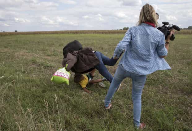 Shocking video shows camerawoman TRIP a refugee dad Shocking video shows camerawoman TRIP a refugee dad