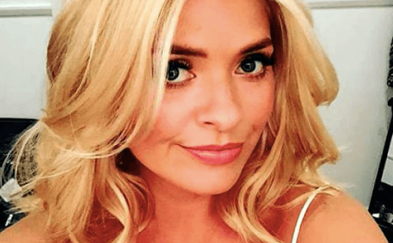 Holly Willoughby is wearing the most DIVINE yellow midi skirt this morning