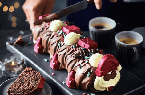 M&S festive offerings: Christmas Colin the Caterpillar and Percy Pig cake