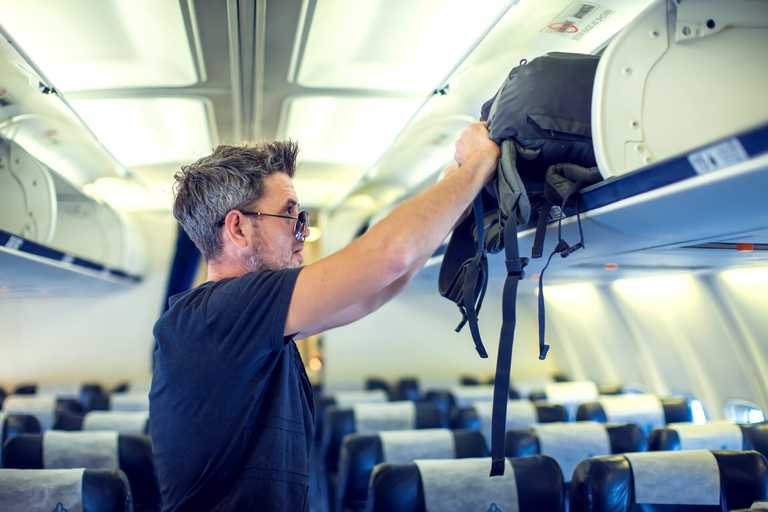 Tourists who stand up too early on plane face fine in new crackdown