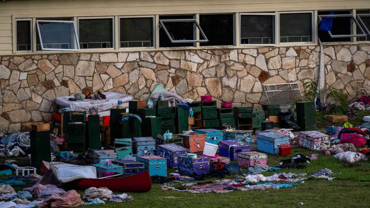 Camp counsellors wrote girls’ names on their bodies before evacuating floods that killed at least 100 people