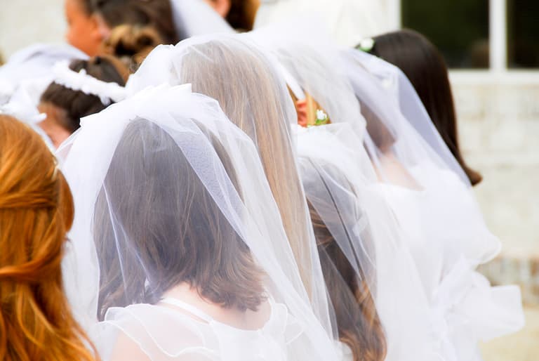 Irish school praised for giving away free Communion dresses and suits