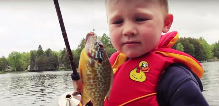 3-year-old catches his first fish. Isn’t quite sure what to do next