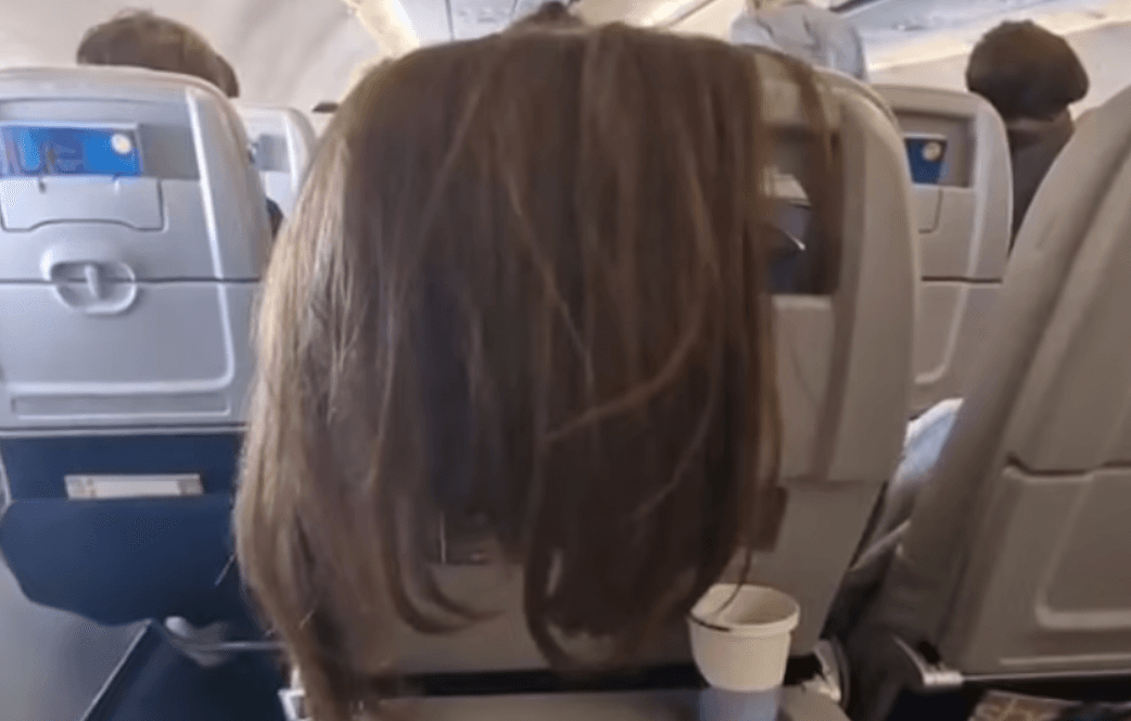 Woman left stunned after plane passenger drapes hair over back of her seat