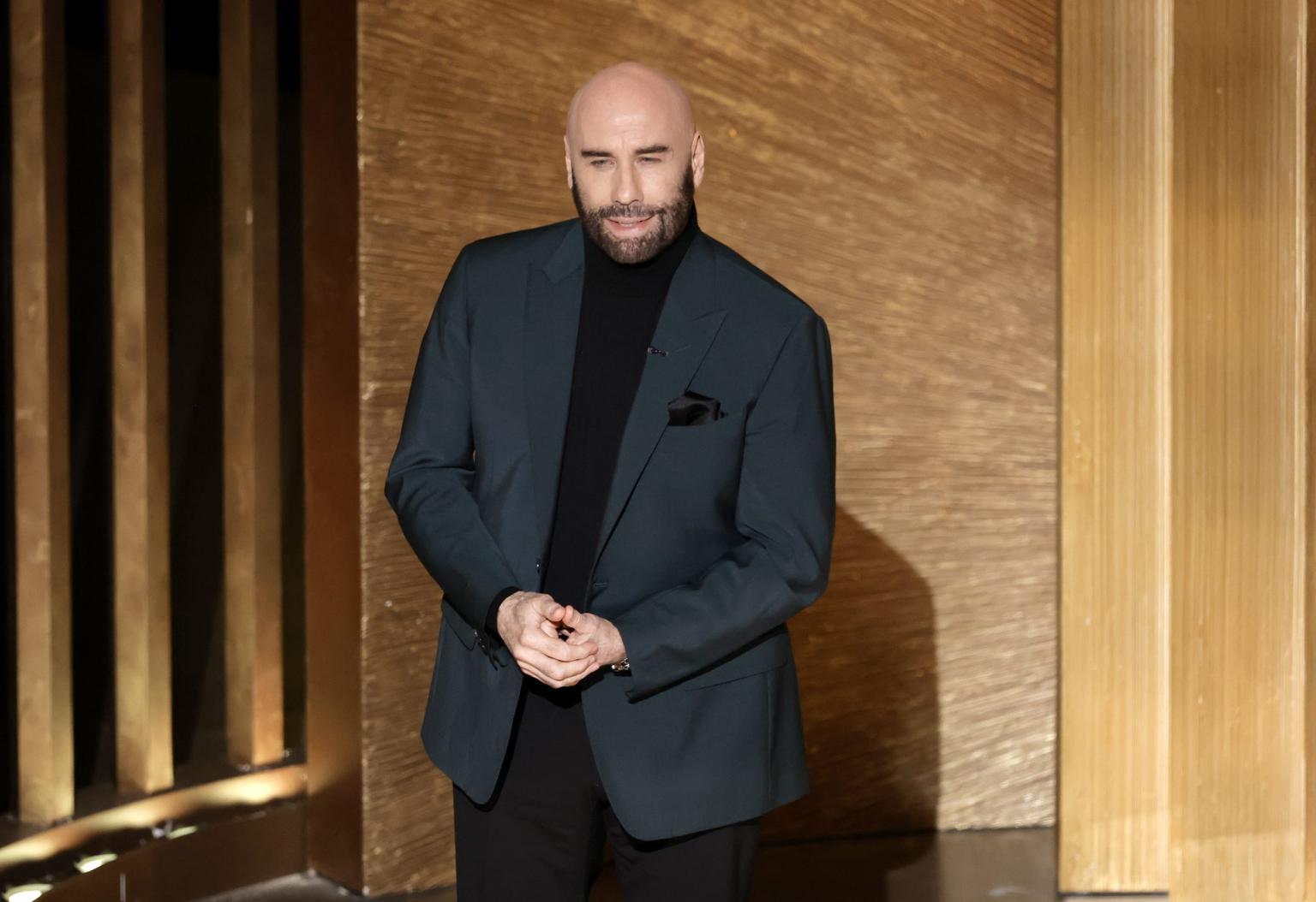 John Travolta fights back tears during Oscar tribute to Olivia Newton-John