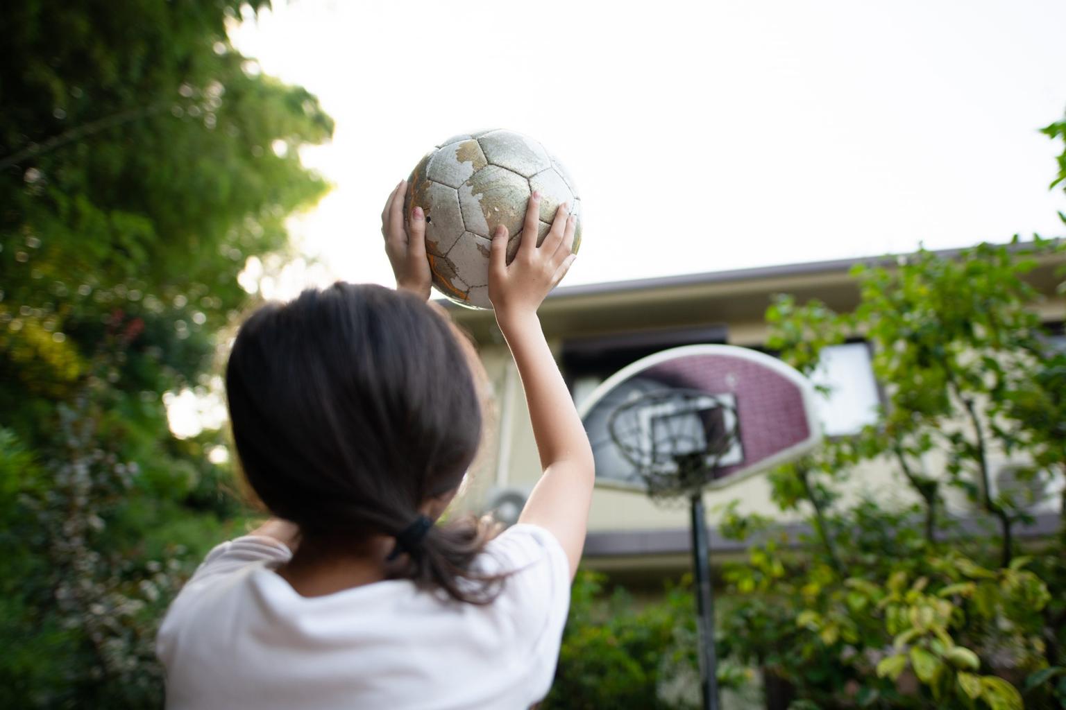 Six year old girl shot after trying to retrieve basketball