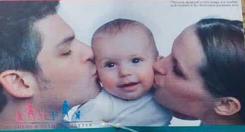Stock photo couple are not too happy with this poster Stock photo couple are not too happy with this poster