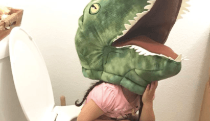Toddler refuses to take her giant fluffy toy dinosaur head off… even while peeing Toddler refuses to take her giant fluffy toy dinosaur head off… even while peeing