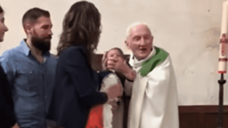 Priest who was seen slapping a crying baby has tried to explain his actions Priest who was seen slapping a crying baby has tried to explain his actions