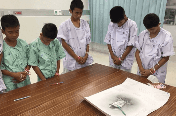 Thai boys rescued from flooded cave mourn diver who died during mission to save them Thai boys rescued from flooded cave mourn diver who died during mission to save them