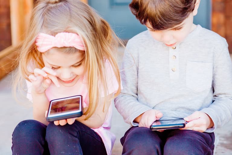 Kids glued to their phones? This genius tip will put a stop to their addiction Kids glued to their phones? This genius tip will put a stop to their addiction