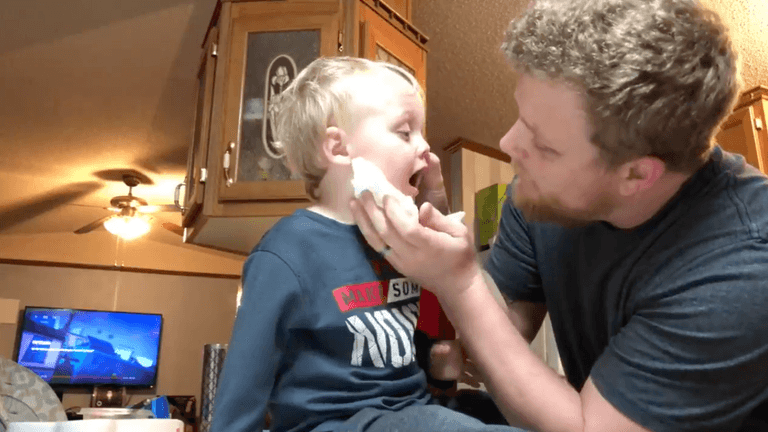 This dad trying to suck a piece of pasta from his toddler’s nose is all of us This dad trying to suck a piece of pasta from his toddler’s nose is all of us