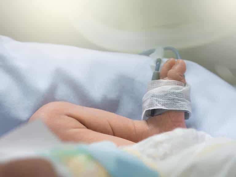 Newborn survives night of being packed in a suitcase and buried alive Newborn survives night of being packed in a suitcase and buried alive
