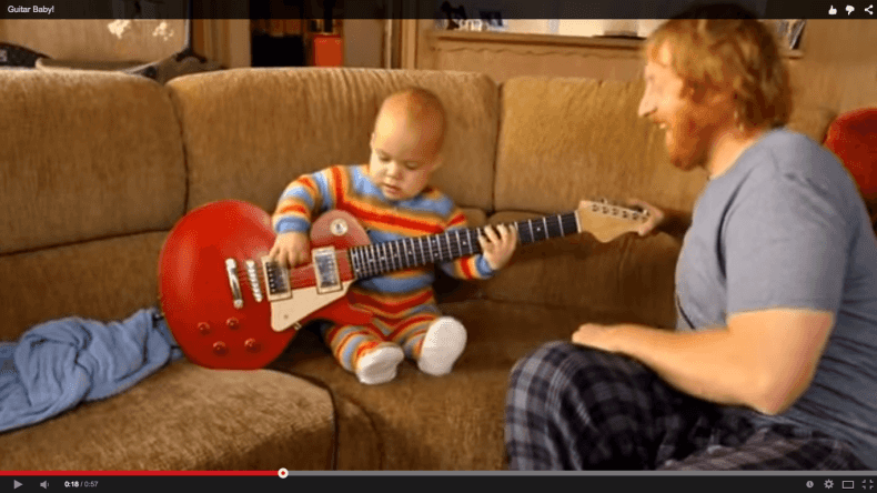 WATCH: This cute little baby playing guitar