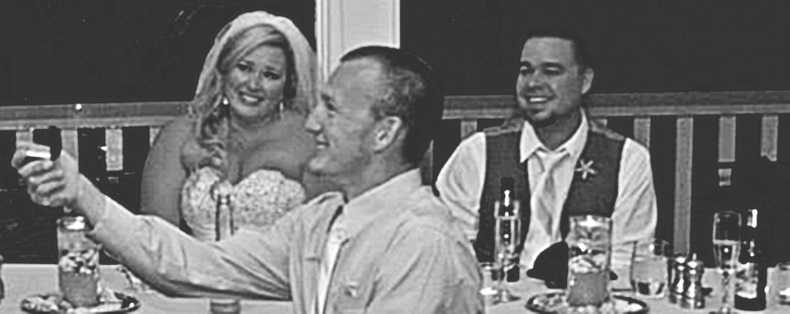 One of the men in this wedding photo is making a HUGE mistake.