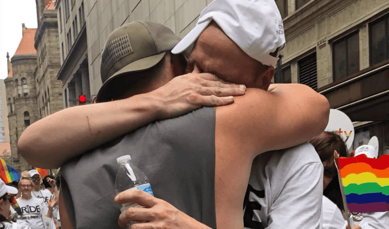 Dad calls on parents to love their gay kids after comforting LGBT people during Pride march Dad calls on parents to love their gay kids after comforting LGBT people during Pride march