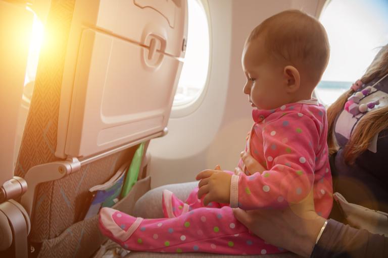 Mum calls out plane passenger annoyed by her crying toddler Mum calls out plane passenger annoyed by her crying toddler