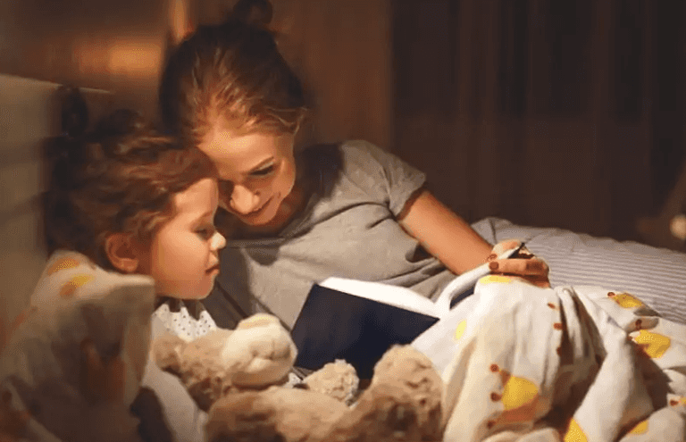 Reading bedtime stories together will make families happier, studies find Reading bedtime stories together will make families happier, studies find