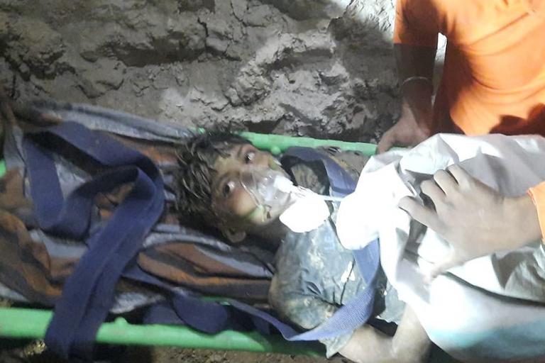Young boy found alive after being trapped in well for four days Young boy found alive after being trapped in well for four days