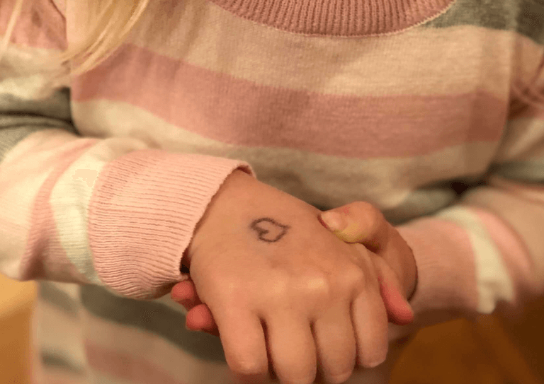 Mum reveals the heartbreaking reason she draws a heart on her daughter’s hand every day Mum reveals the heartbreaking reason she draws a heart on her daughter’s hand every day