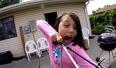 This girl just shot her wobbly tooth out with a sling bow