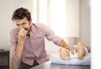 The 5 stages of wrestling a squirming child into a nappy