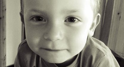 This is Aaron. His mum has chained herself to the Dept. gates in a row over his education.