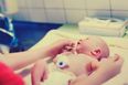 What is delayed cord clamping and why is it important for newborn babies?