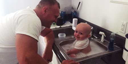 Cop Rescues Baby, Pops Him In The Station Sink For A Quick Bath
