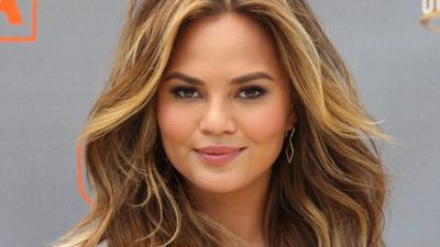 Chrissy Teigen and her daughter wearing matching avocado suits is TOO cute