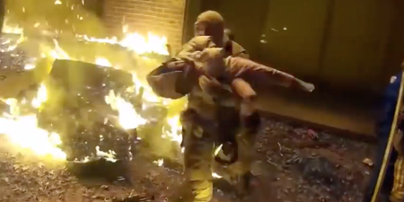 Shocking footage shows incredible rescue of child thrown from house fire