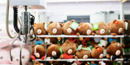 Little boy rescued after climbing INSIDE claw machine to get a toy