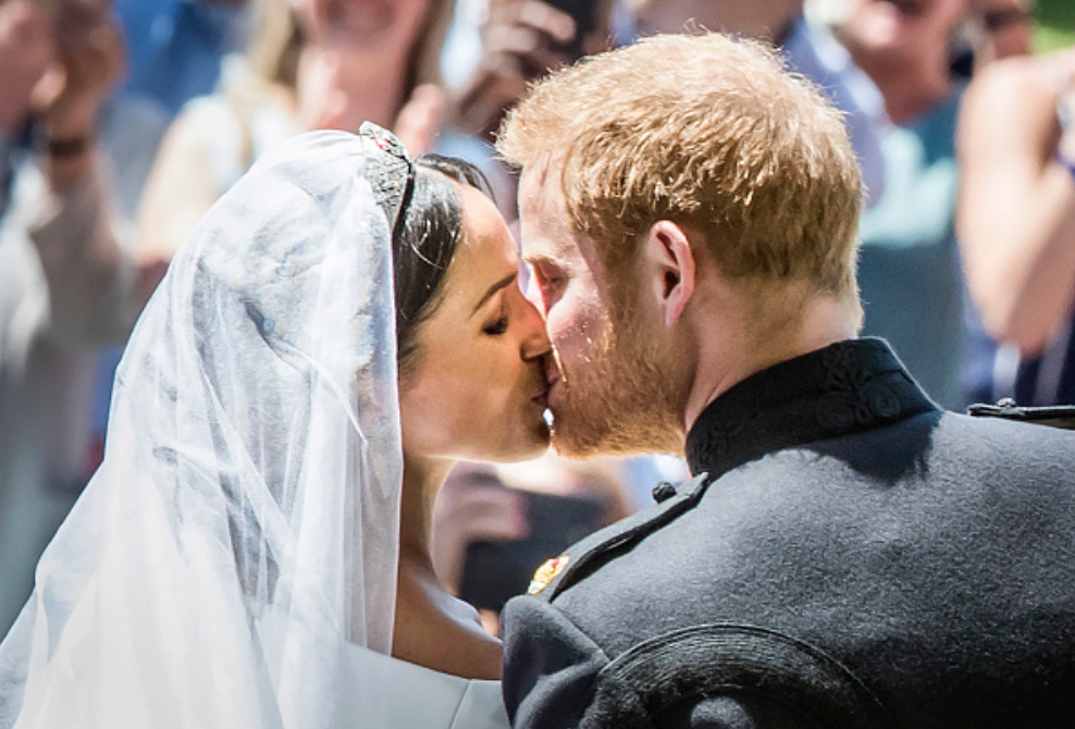 Prince Harry got a sneak peek at Meghan's wedding look before their big day