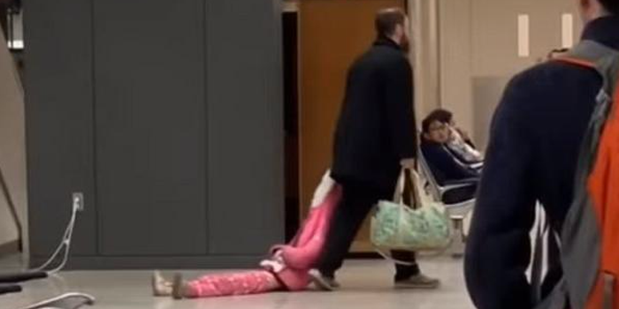 This dad dragging his child through an airport is the most relatable thing we've ever seen