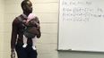 Professor carries student’s baby during lecture so young dad can take notes