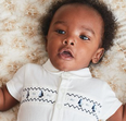 This smocked baby bodysuit from Next is giving us royal vibes