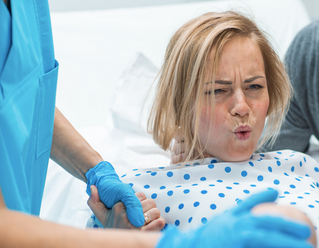 midwife claims giving birth on your back in more painful