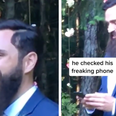 Viral video catches groom checking his phone while walking down the aisle