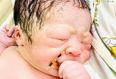 Baby pictured holding mum’s failed IUD after ‘miracle’ pregnancy