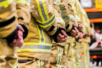 Toddler burnt in blaze that killed mother & sister celebrates birthday with firefighters who saved him