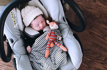 Turns out, we have all been carrying baby car seats the completely wrong way