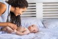 Expert claims parents should stop lifting baby’s legs when changing their nappy